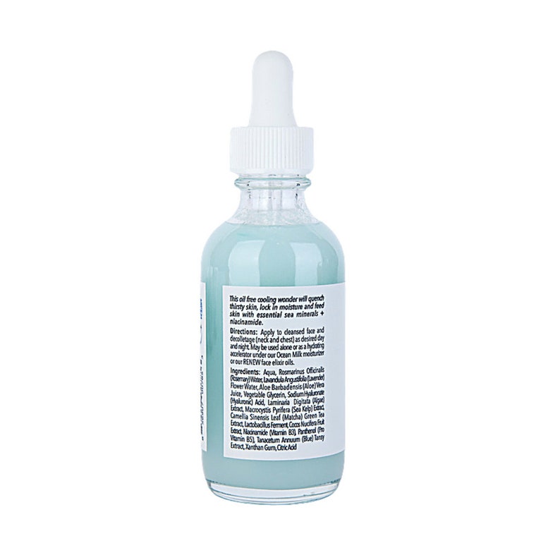 May include: A clear glass bottle with a blue liquid inside. The bottle has a dropper top and a label with text that reads "This oil free cooling wonder will quench thirsty skin, lock in moisture and feed skin with essential sea minerals + niacinamide."