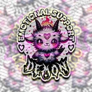 May include: A sticker featuring a fluffy, purple and white creature with horns, large eyes, and a heart-shaped pentagram on its forehead. The text reads EMOTIONAL SUPPORT DEMON, surrounded by small pink hearts, a flame, and a pink heart pendant.