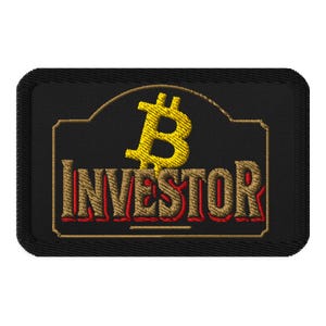 May include: Black embroidered patch featuring a gold Bitcoin symbol above the word "INVESTOR" in gold and red lettering. The patch has a black border and a gold frame around the text.