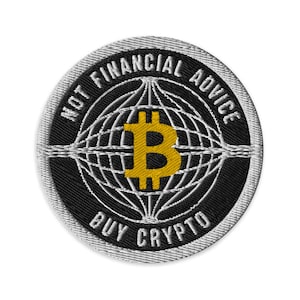 May include: Embroidered patch with a black background and a silver border. The patch features a gold Bitcoin symbol at the center, surrounded by a white globe design. The text "NOT FINANCIAL ADVICE" and "BUY CRYPTO" are embroidered in white.