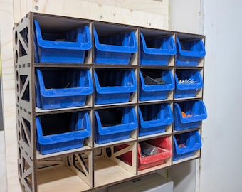 May include: A wall-mounted storage system made of wood with 18 blue plastic bins. The bins are organized in a grid pattern and are filled with various small items, such as screws, nuts, and bolts.