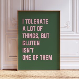 May include: A green poster with white text that reads "I tolerate a lot of things, but gluten isn't one of them". The text is in pink.