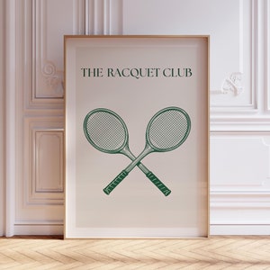May include: A white poster with a green illustration of two crossed tennis rackets and the text "THE RACQUET CLUB" in green.