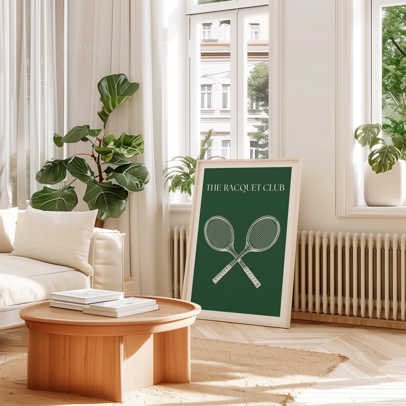 May include: A green poster with white text that reads "The Racquet Club" and a drawing of two crossed tennis rackets.