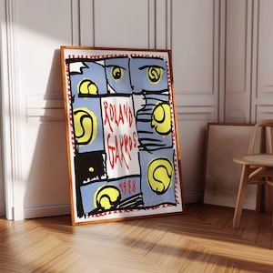 May include: A vintage poster for the 1988 Roland Garros tennis tournament. The poster features a blue and white background with a red and white border. The text "Roland Garros 1988" is written in red letters. There are several tennis balls depicted on the poster.