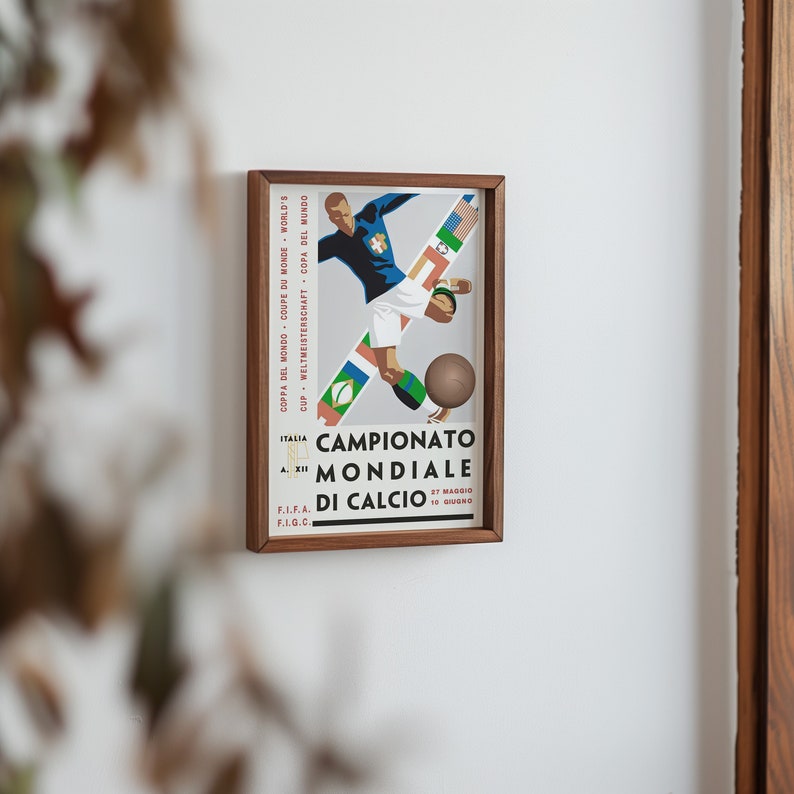 May include: A framed poster with a vintage design featuring a football player in a blue jersey kicking a ball. The poster is titled "Campionato Mondiale di Calcio" with the dates "27 Maggio" and "10 Giugno" printed below.