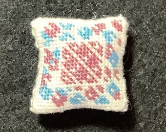 Dollhouse Miniature Needlepoint - Square Pillow with Burgundy Diamond Pattern and Blue and Burgundy Floral Border on Off-White