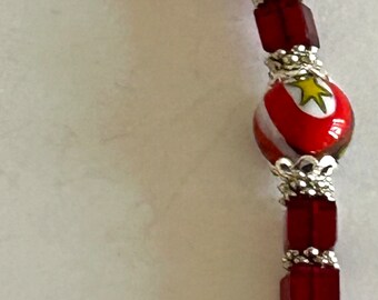 Adjustable women’s bracelet red Swarovski Crystal and Italian Millefiore beads, silver plated Pewter, dress it up or down , fits most wrists