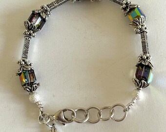 Adjustable Swarovski Crystal and Silver Plated Pewter women’s beaded bracelet, the colors in the crystal makes it versatile to wear