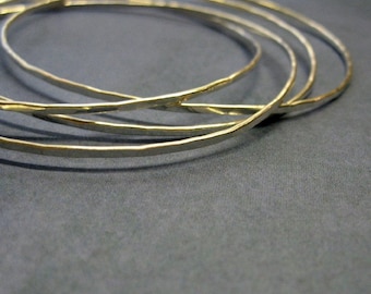 sterling silver bangles. four intertwined bangles in one