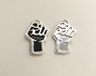 small Silver Raised Fist pendant. RESIST