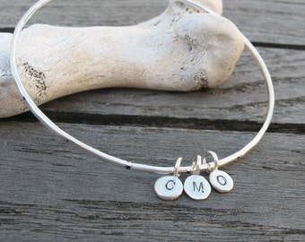 Personalized sterling silver bangle hammered and dotted with 3 custom initial tags by VisionQuest