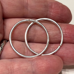 round 14ga sterling silver seamless hoops. range of sizes 0.5in to 1 in