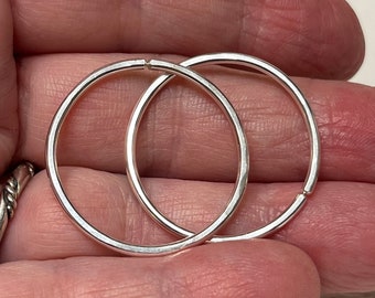 round 14ga sterling silver seamless hoops. range of sizes 0.5in to 1 in