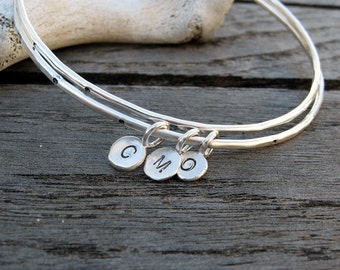 Personalized sterling silver bangle with silver initial tag by VisionQuest