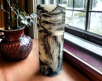 Cliff with trees and house, extra-large, real wax LED candle, Asian style landscape art of a rocky cliff on an ivory color candle, 3"x8".