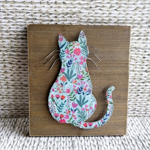 Unique decoupaged 3 dimensional metal cat mounted on wood with built in hanger on back, floral design, 7"x8".