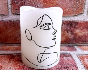 Line drawing profile of a woman real wax flameless candle, black, simple silhouette of a young woman, LED candle, 3"x4".