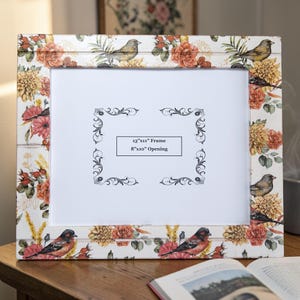 Decoupaged bird and floral pattern on a white wood frame with a 8"x10" opening, white wood table-top or wall frame, bird and flower design.