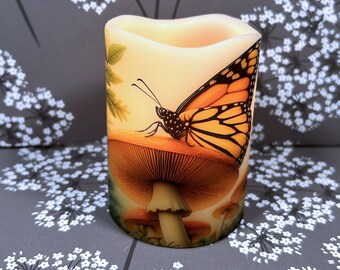 Butterfly poised on mushroom, real wax flameless candle, for any decor, pillar candle with nature inspired design, great for spring,  3&quot;x4&quot;.