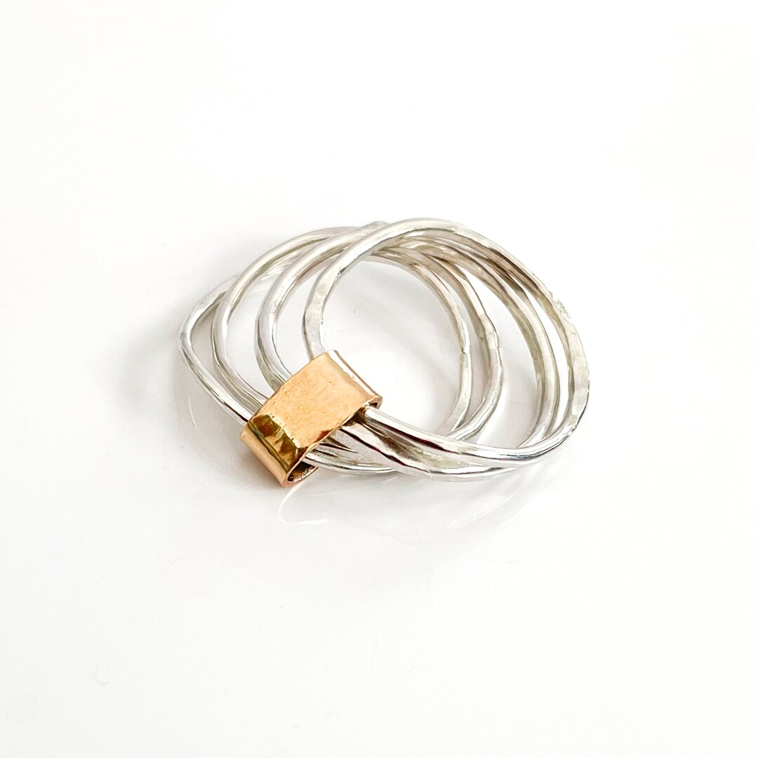 A Modern Mixed Metal Ring With 4 Sterling Silver Bands Wrapped in a ...