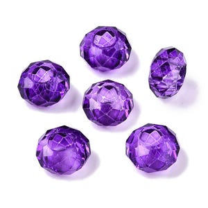 May include: Six purple faceted glass beads with a hole in the center. The beads are round and have a shiny finish.