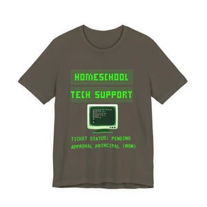 May include: An olive green t-shirt featuring the words "HOMESCHOOL TECH SUPPORT" in green, and a retro computer graphic. Underneath, the text reads "TICKET STATUS: PENDING APPROVAL PRINCIPAL (MOM)".
