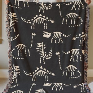 dinosaur fossils woven throw blanket, dinosaur skeletons kids black woven blanket, triceratops brachiosaurus stegosaurus, dino wall tapestry