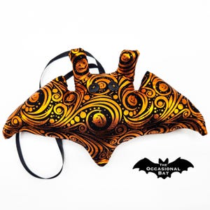 Black Microbat with Orange Foil Pumpkins and Swirls