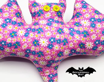 Pink Bat Pillow with Blue, White, and Pink Flowers