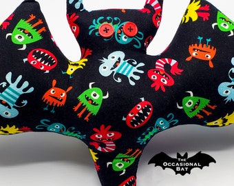 Black Bat Pillow with Colorful Monsters