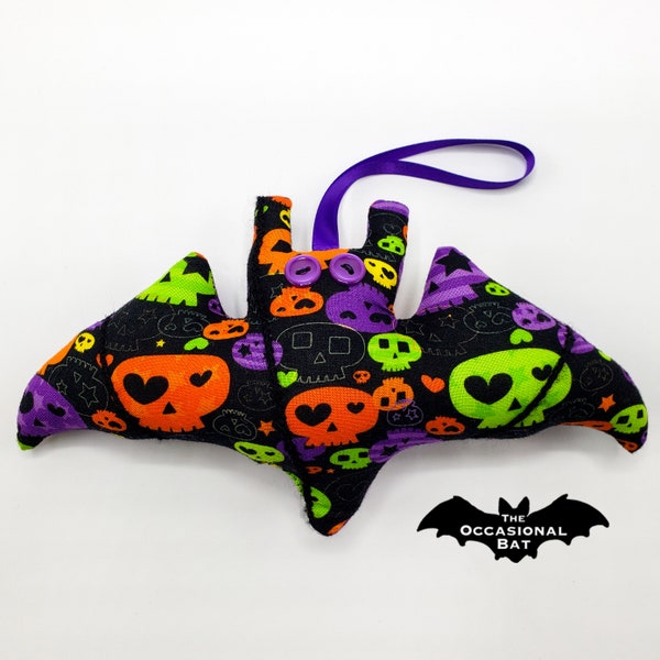 Black Microbat with Green, Orange, and Purple Skulls