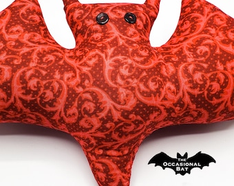 Red and Maroon Bat Pillow with Swirls