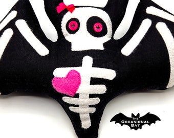 Pink Heart Skeleton Bat Pillow with a Pink Bow