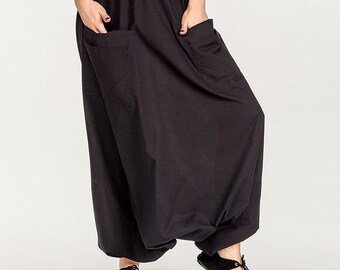 Women’s black cotton Aladdin pants with patch pockets, comfortable for yoga and everyday wear