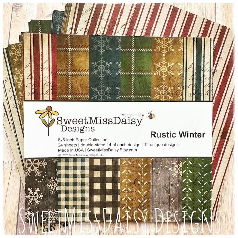 May include: A stack of 6x6 inch double-sided paper sheets with various rustic winter designs. The designs include snowflakes, plaid, stripes, and wood grain patterns in shades of green, brown, and red. The package is labeled "Rustic Winter" by SweetMissDaisy Designs.