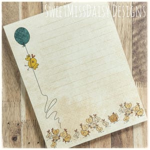 May include: A yellow chick with a blue balloon flies over a group of yellow chicks on a lined sheet of paper with the text "Sweetmissdaisy Designs" at the top.