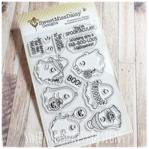 May include: A set of clear photopolymer stamps by SweetMissDaisy Designs featuring various ghost illustrations and Halloween-themed text including You're SPOOKTACULAR, Wishing you a FAB-BOO-LOUS Halloween, Too cute to SPOOK, Just here for the TREATS, and BOO.