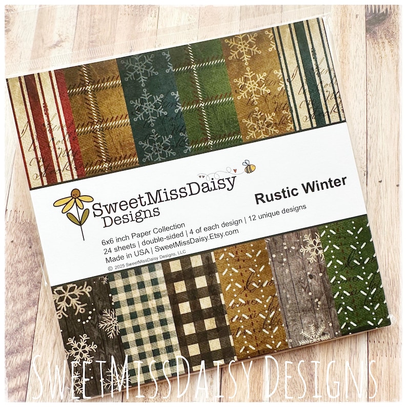 May include: A paper collection titled "Rustic Winter" with various patterns, including snowflakes, plaid, and wood grain. The package is 6x6 inches and contains 24 double-sided sheets with 12 unique designs. The brand name is SweetMissDaisy Designs.