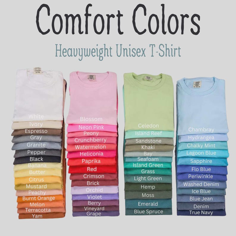 May include: Four stacks of Comfort Colors Heavyweight Unisex T-Shirts in various colors. Each shirt is labeled with its specific color name, including White, Ivory, Espresso, Gray, Granite, Pepper, Black, Banana, Butter, Citrus, Mustard, Peachy, Burnt Orange, Melon, Terracotta, Yam, Blossom, Neon Pink, Peony, Crunchberry, Watermelon, Heliconia, Paprika, Red, Crimson, Brick, Orchid, Violet, Berry, Vineyard, Grape, Celedon, Island Reef, Sandstone, Khaki, Bay, Seafoam, Island Green, Grass, Light Green, Hemp, Moss, Emerald, Blue Spruce, Chambray, Hydrangea, Chalky Mint, Lagoon Blue, Sapphire, Flo Blue, Periwinkle, Washed Denim, Ice Blue, Blue Jean, Denim, and True Navy.