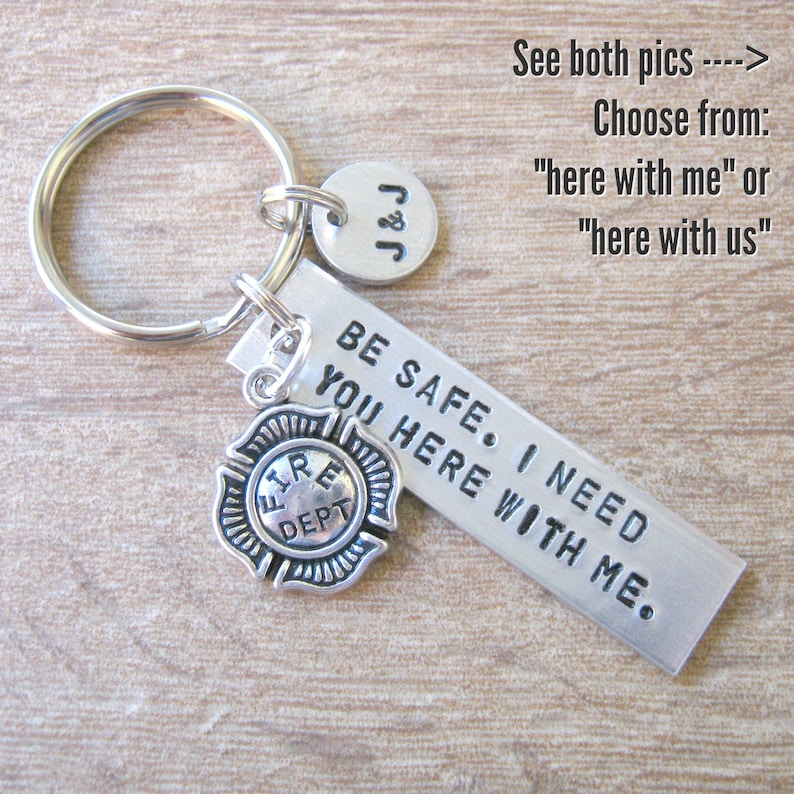 May include: Silver keychain with a firefighter charm, a tag that says "BE SAFE. I NEED YOU HERE WITH ME." and a small tag that says "J&J".
