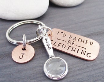 Personalized True Crime humor Keychain, True Crime Lover gift, I'd Rather Be Sleuthing, magnfying glass charm, optional initial disc