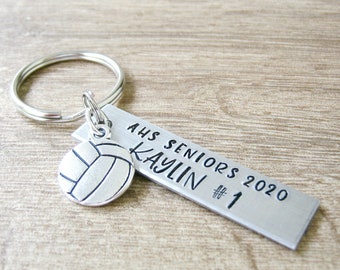 May include: Silver keychain with a volleyball charm and a silver tag that reads "AHS Seniors 2020 Kaylin #1"