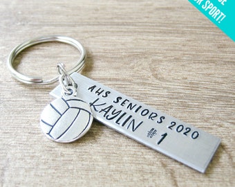 May include: Silver keychain with a volleyball charm and a personalized tag that reads "AHS Seniors 2020 Kaylin #1".