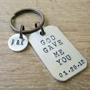 May include: Silver keychain with a tag that reads "God Gave Me You 01.25.12" and a smaller tag with the initials "D & K".