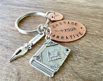 Embrace Your Narrative Keychain Copper with book and pen charms, author gift, novelist gift, journalist gift, writer gift, writer's keychain