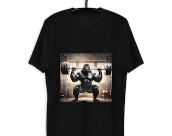 May include: Black t-shirt featuring a graphic of a muscular gorilla lifting a barbell in a gym setting. The gorilla is depicted in a squat position, emphasizing strength and fitness. The design is centered on the shirt, offering a bold statement.