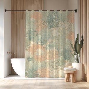 May include: A shower curtain with a botanical design in shades of peach, green, and cream. The pattern features stylized plants and flowers, creating a soft, natural aesthetic. The curtain hangs in a bathroom with a white tub and wooden accents.
