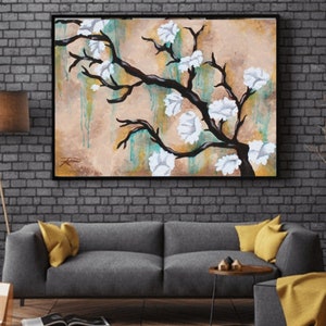 May include: Abstract painting of a white flowering tree branch with a brown trunk against a beige background with green and blue accents.