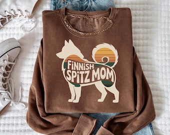Silueta retro de una mamá Spitz finlandesa al atardecer (descarga digital)